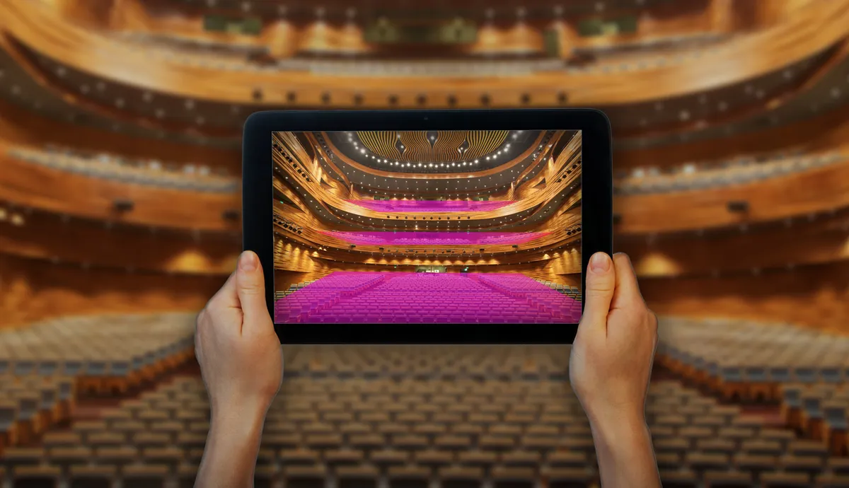 EDC Pro App showing predicted coverage over a theatre, held on an iPad