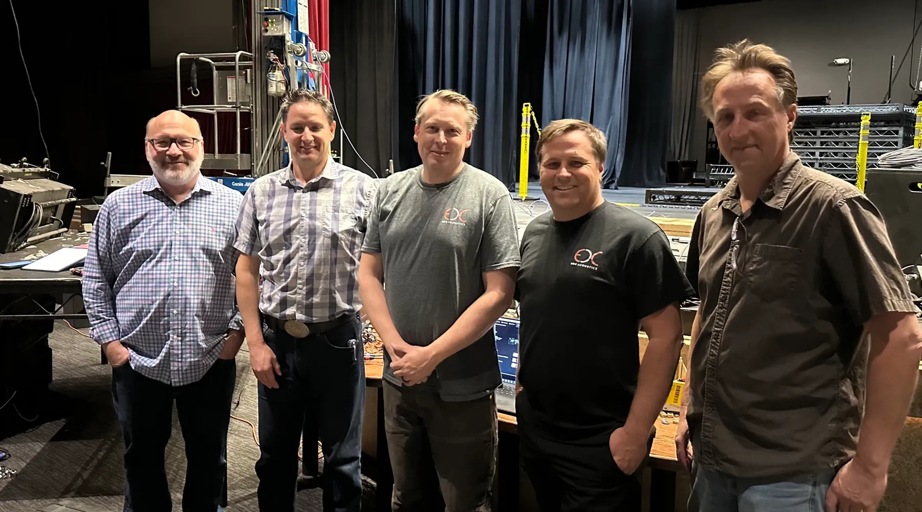 The EDC Acoustics team on stage during a system commissioning